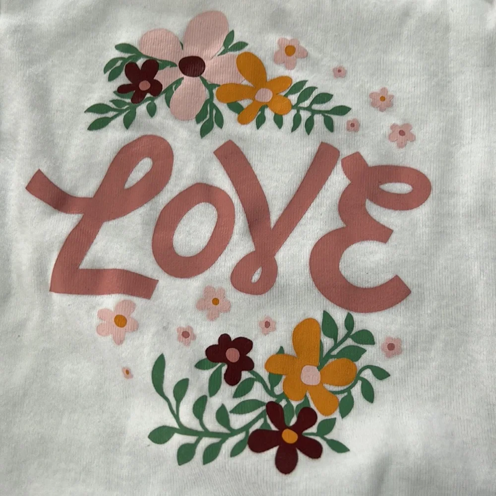 Old Navy white infant girls onsie.Long sleeve w/floral graphic & Love on front
